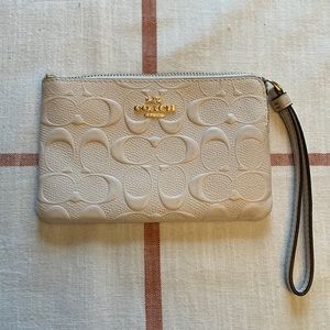 Cream Coach wristlet